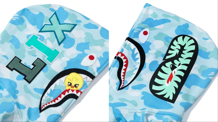 SKZOO角色從鯊魚的牙齒中俏皮探出頭來。品牌提供