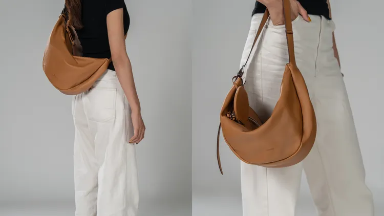 RABEANCO新店獨家首賣的「Asymmetric Crescent 手提袋」，採用新月輪廓帶來慵懶感。品牌提供