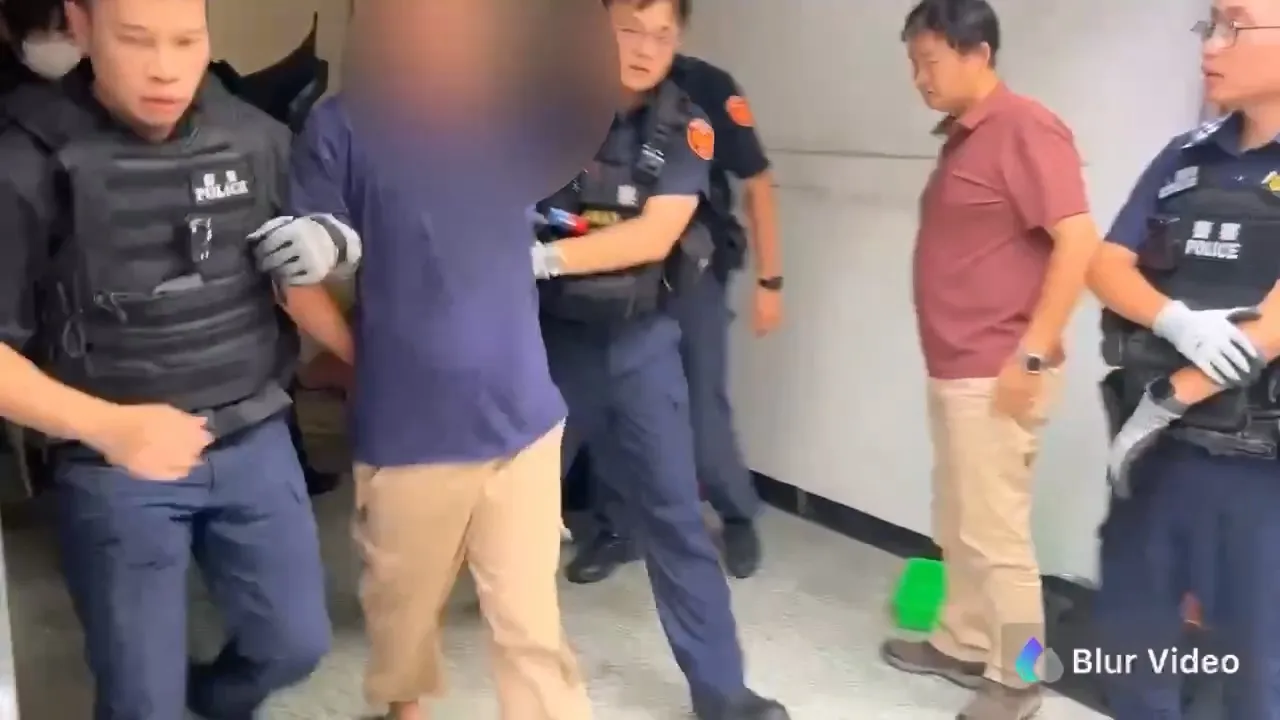 随机砍人的邱姓男子遭警方逮捕。民众提供