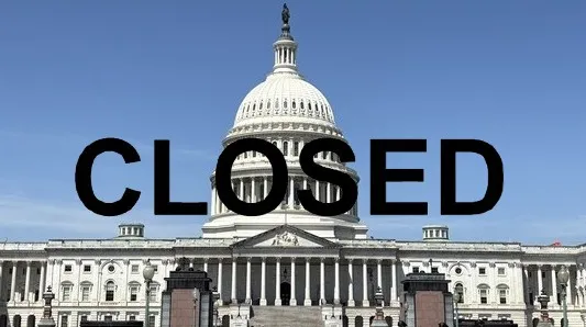 美国政府关门已超过一个月。合成画面。背景为美国国会。中央社