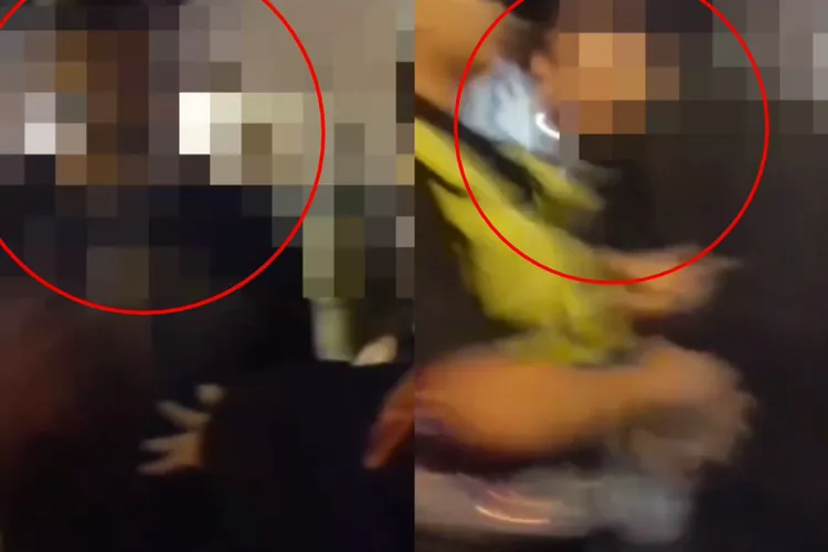 夜店廁所衝突叫囂到信義區街頭，警方居中隔開兩人，台男(右一)與紐籍男子(左一)仍隔空嗆聲，雙雙被帶回派出所管束並開罰。翻攝畫面