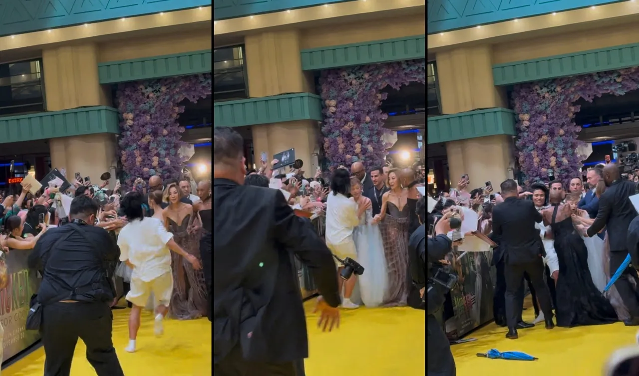 网红乱入电影首映现场，硬要揽住亚莉安娜，被众人拦阻下来。路透社