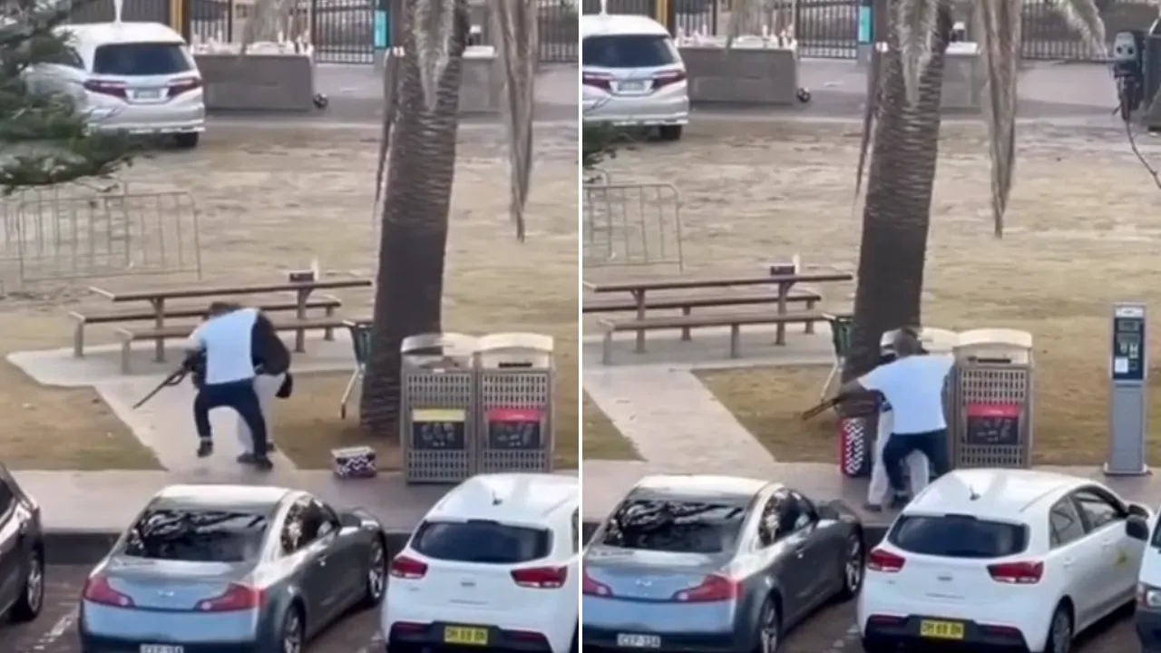 白衣路人跟枪手扭打。9 NEWS