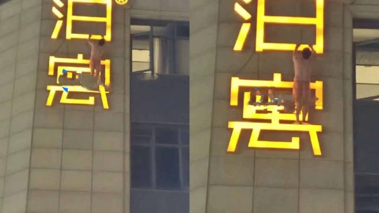 男子全身只穿內褲吊掛在外牆招牌上。翻攝自微博@七七耶耶耶耶