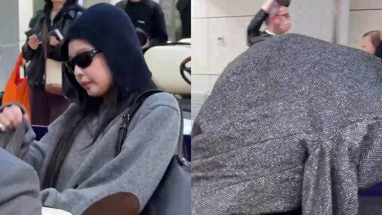BLACKPINK成員Jennie昨日下午抵台，拿著大衣蓋住頭。桃園國際機場記者聯誼會提供