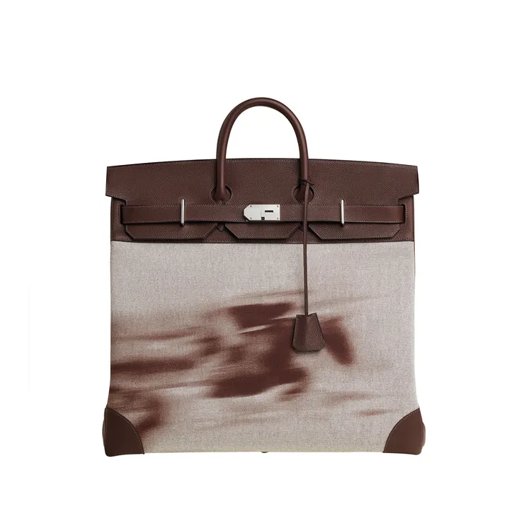 Haut à Courroies 提包，Fast Poudré 圖紋印花 H Plume 帆布、Togo 小牛皮與 Swift 小牛皮材質，89萬1400元。品牌提供