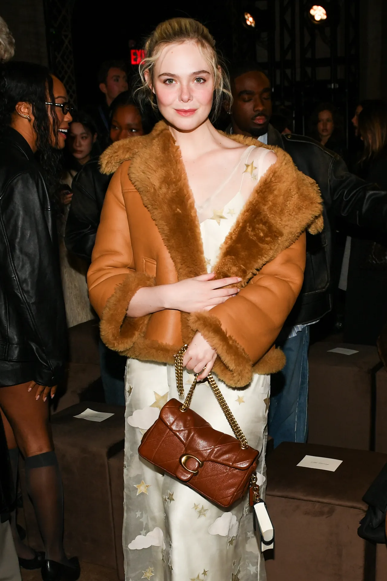 艾兒芬妮現身COACH 2026秋冬大秀。品牌提供