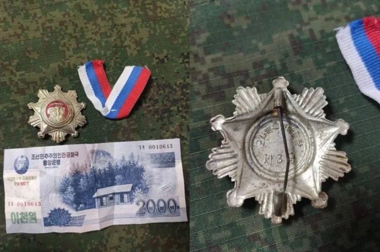 烏克蘭軍隊從前線北韓軍人身上查獲的勳章、紙鈔等物品。翻攝南韓《中央日報》