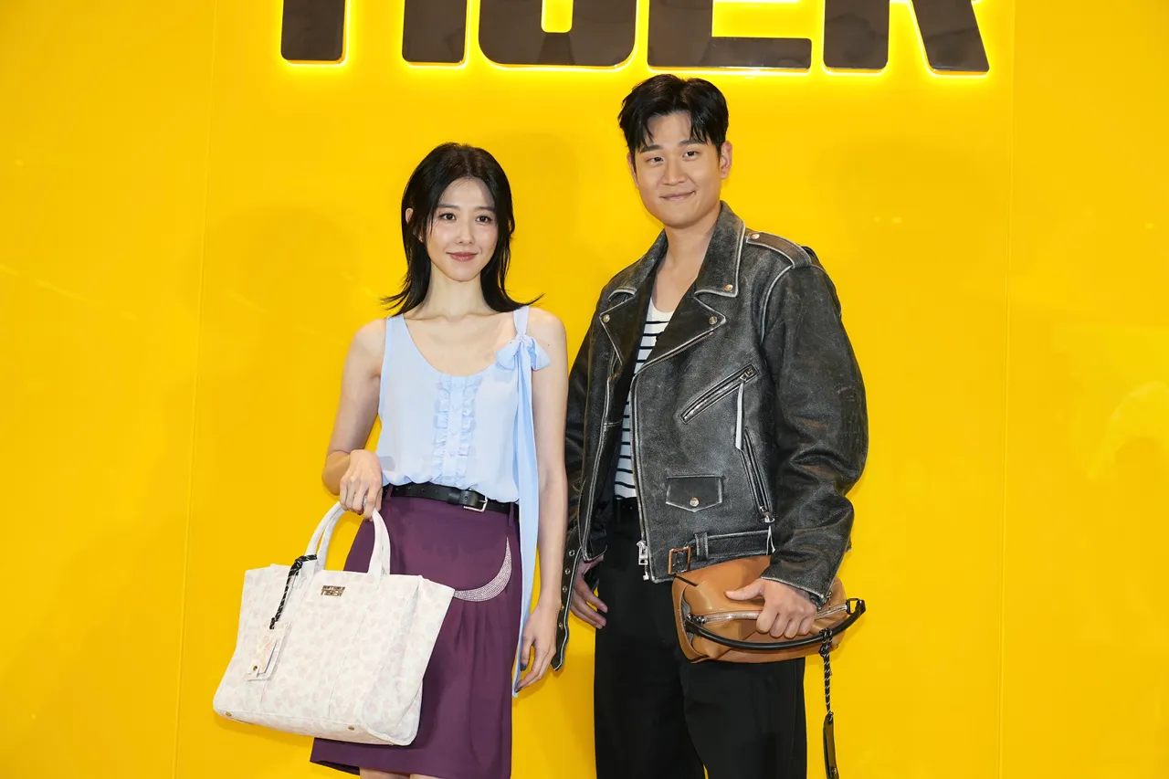 邵雨薇（左）與周興哲今日出席鬼塚虎微風南山概念店開幕活動。彭欣偉攝