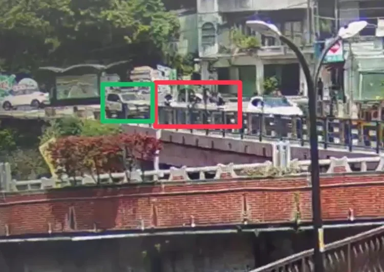 休旅車陳男(綠框)攔下騎機車許男等人(紅框)，並拿出球棒恐嚇對方道歉，被害人來此遊玩以為遇到地頭蛇連忙低頭說對不起。翻攝畫面