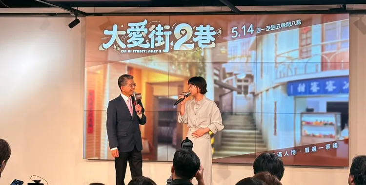 嚴正嵐上台時頻頻摸肚子。王思穎攝