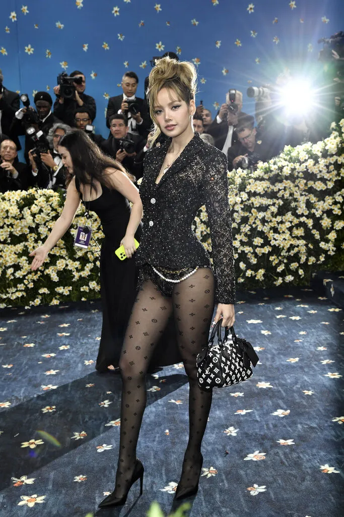 Lisa從去年的賓客身分躍升至主辦委員會成員。美聯社