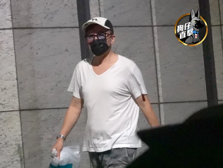 孫鵬出門倒垃圾，帽子口罩戴好戴滿。特勤中心攝