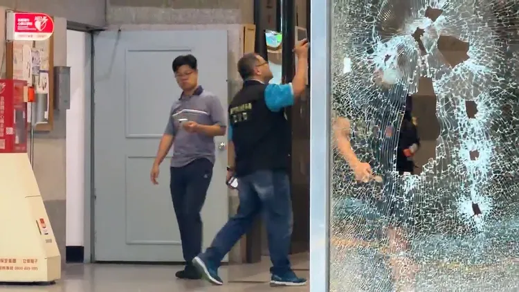 台中商辦遭開槍掃射，警方在現場採證。民眾提供
