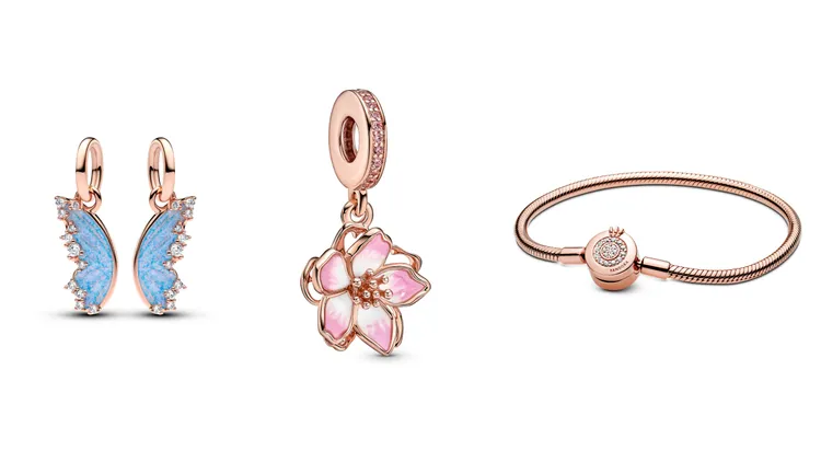 PANDORA可拆分蝴蝶吊飾（左起）3680元、綻放春櫻吊飾3680元、璀璨皇冠O蛇鍊7080元。品牌提供