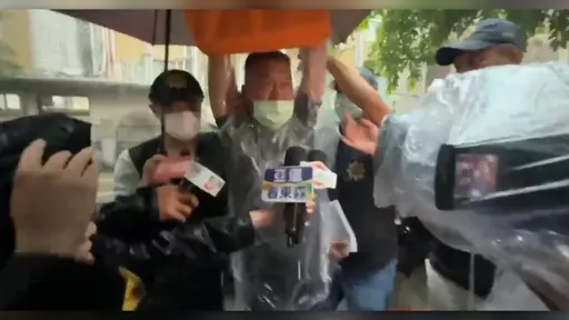 衝撞北檢運將10萬交保　移送時高舉雙手大喊「司法已死、官逼民反」